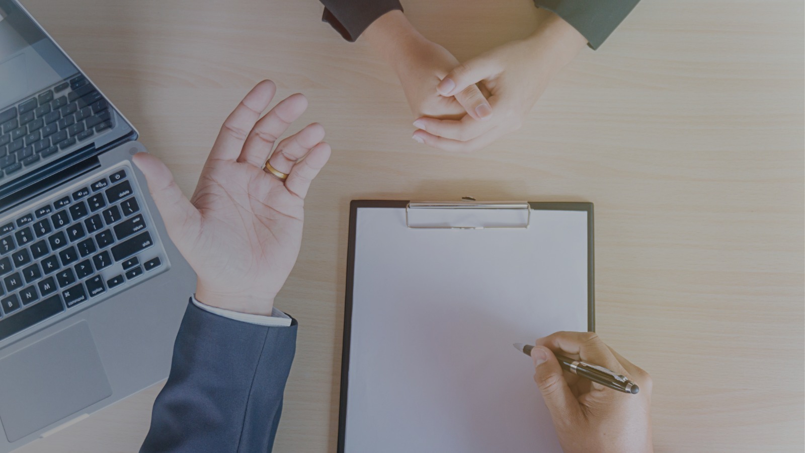 Pharmacist assisting customer at modern pharmacy counter